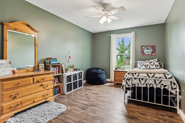 bedroom with hardwood / wood-style flooring and ceiling fan