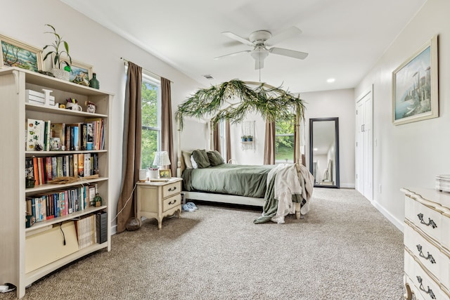 carpeted bedroom featuring ceiling fan