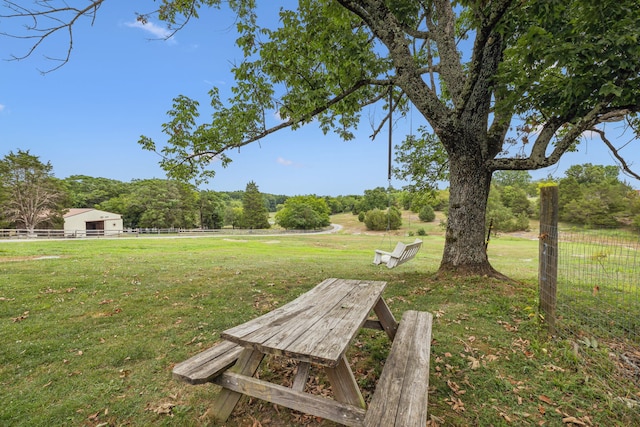 view of yard with a rural view