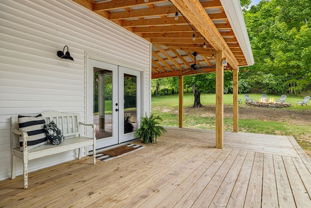 wooden deck featuring french doors