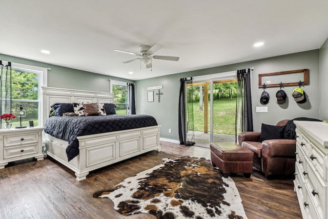 bedroom with dark hardwood / wood-style floors, access to outside, multiple windows, and ceiling fan