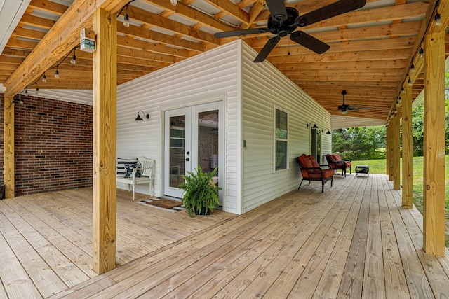 wooden deck featuring french doors and ceiling fan