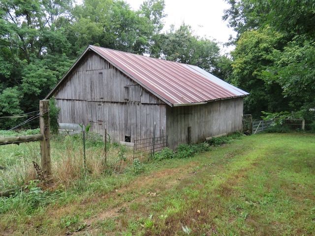 view of outbuilding with a lawn