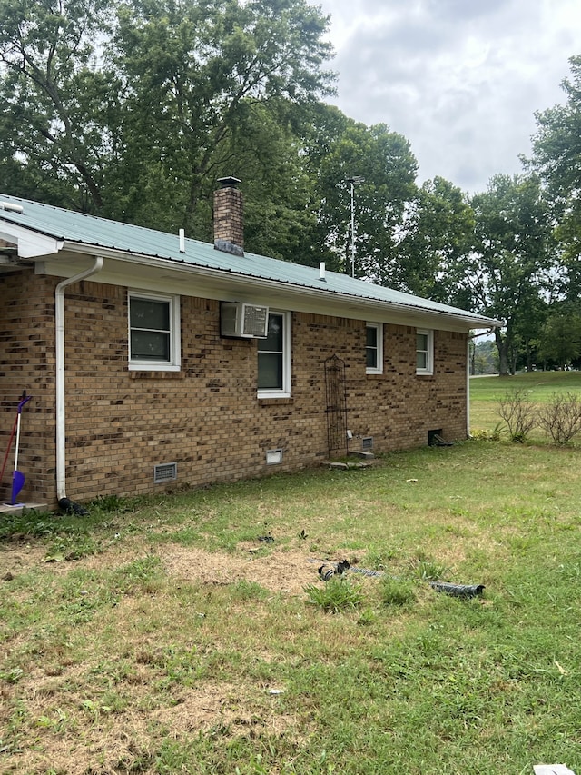 rear view of house with a lawn