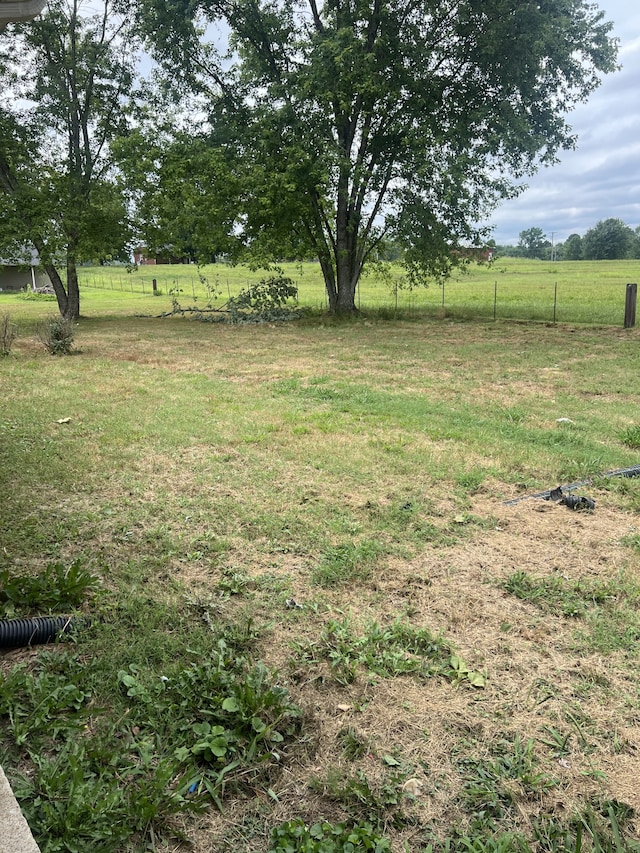 view of yard with a rural view