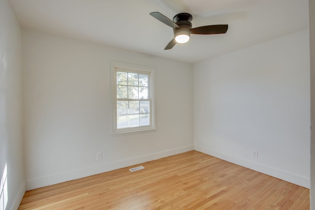 unfurnished room with light hardwood / wood-style flooring and ceiling fan