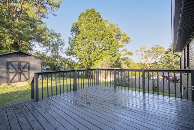 deck featuring a lawn and a shed