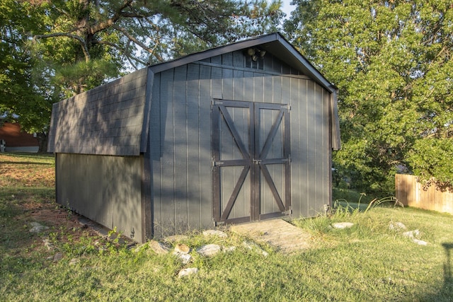 view of outbuilding featuring a yard