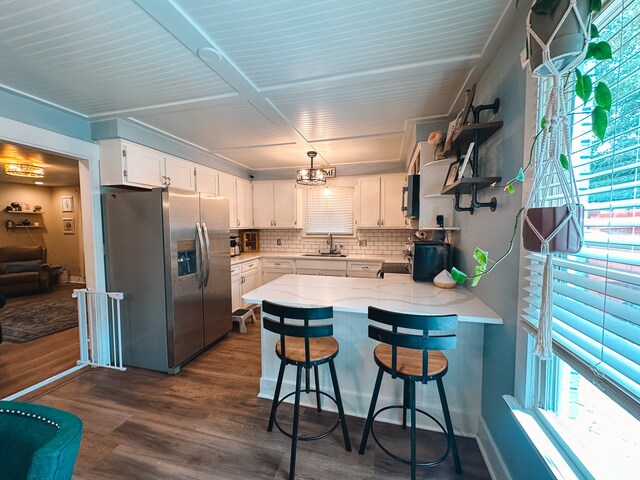 kitchen featuring white cabinetry, stainless steel fridge with ice dispenser, backsplash, and dark wood-type flooring