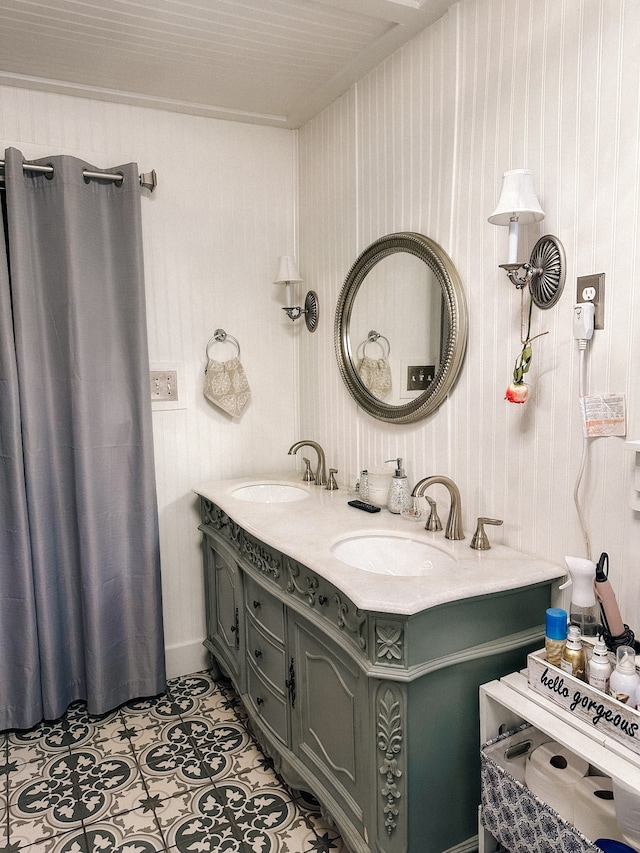 bathroom featuring tile patterned flooring and dual vanity