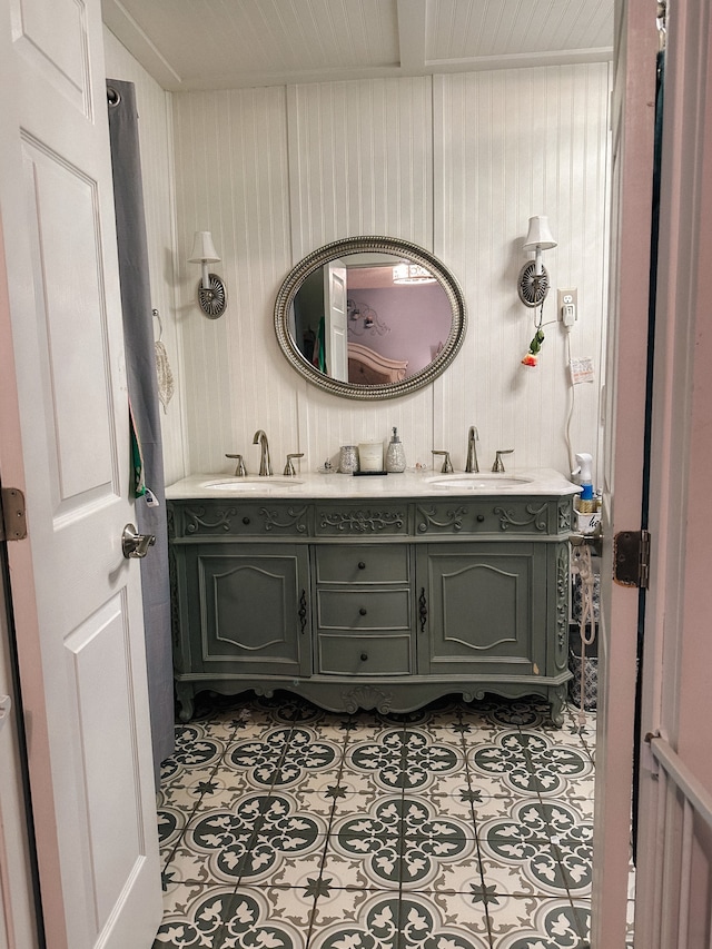 bathroom featuring tile patterned floors and double sink vanity