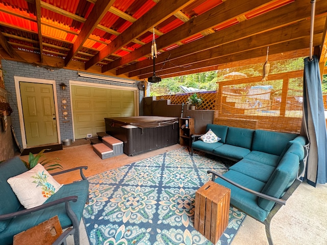 view of patio featuring a hot tub and an outdoor hangout area