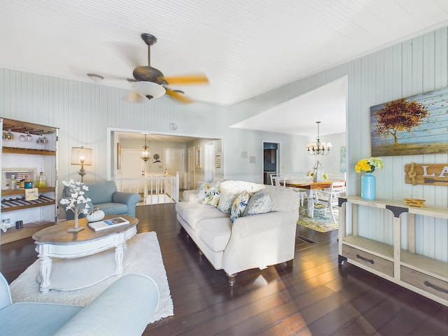 living room with dark hardwood / wood-style floors and ceiling fan with notable chandelier