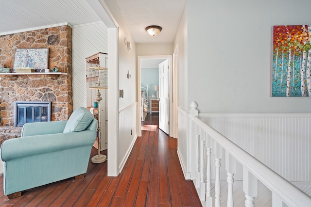 corridor with crown molding and hardwood / wood-style floors