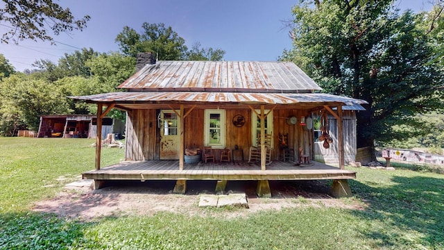 view of outbuilding with a lawn