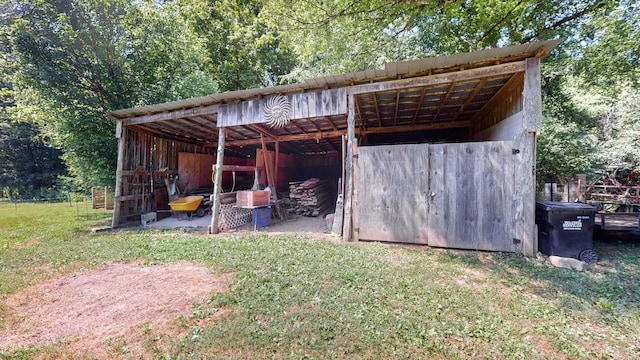 view of outdoor structure featuring a lawn