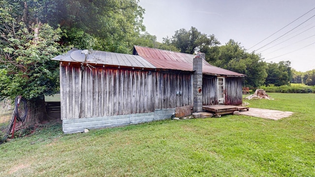 view of property exterior featuring a lawn