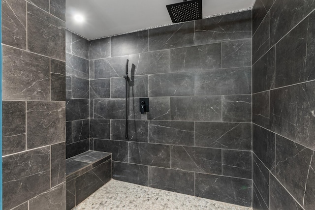 bathroom with tiled shower