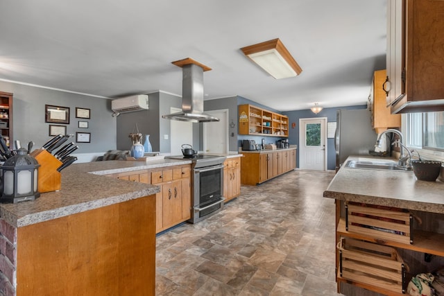 kitchen featuring a wall mounted AC, sink, island exhaust hood, and stainless steel appliances