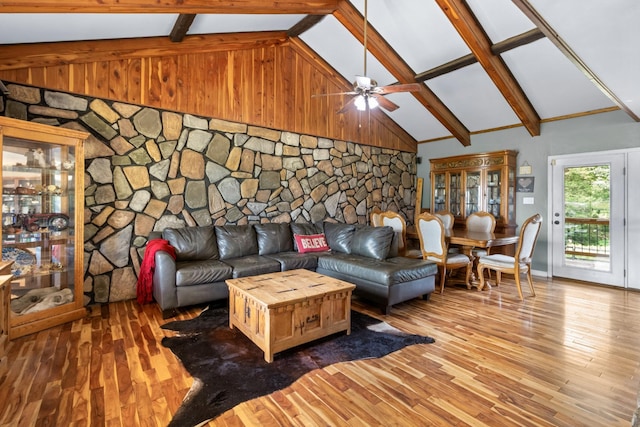 living room with high vaulted ceiling, hardwood / wood-style flooring, beamed ceiling, and ceiling fan