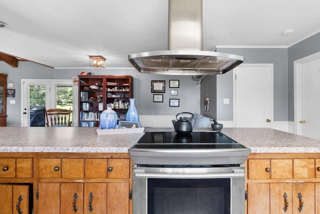 kitchen featuring stainless steel range with electric cooktop and island range hood