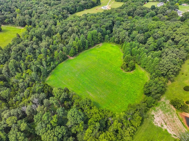 birds eye view of property with a rural view