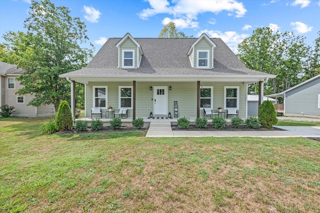 view of front facade featuring covered porch and a front yard