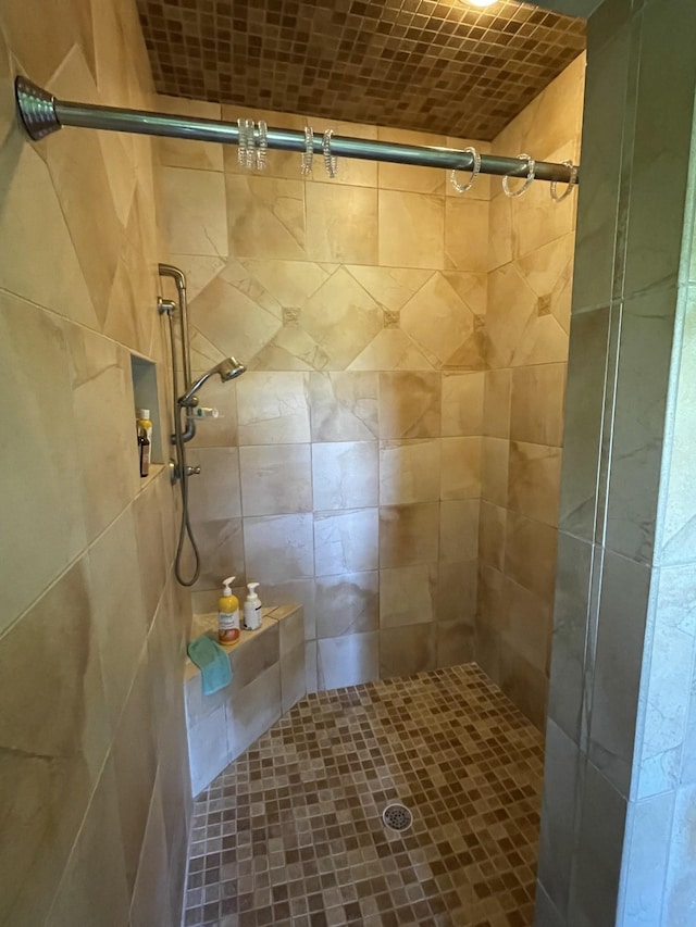 bathroom with tiled shower