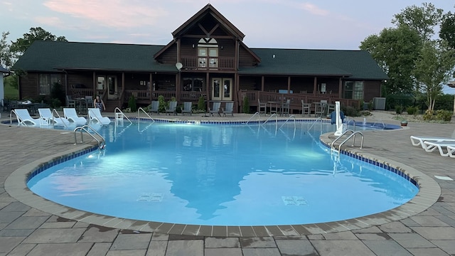 view of swimming pool with a patio