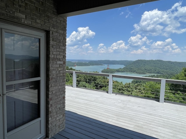 wooden deck featuring a water view