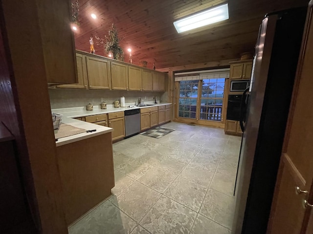 kitchen with a sink, stainless steel appliances, wooden ceiling, light countertops, and vaulted ceiling