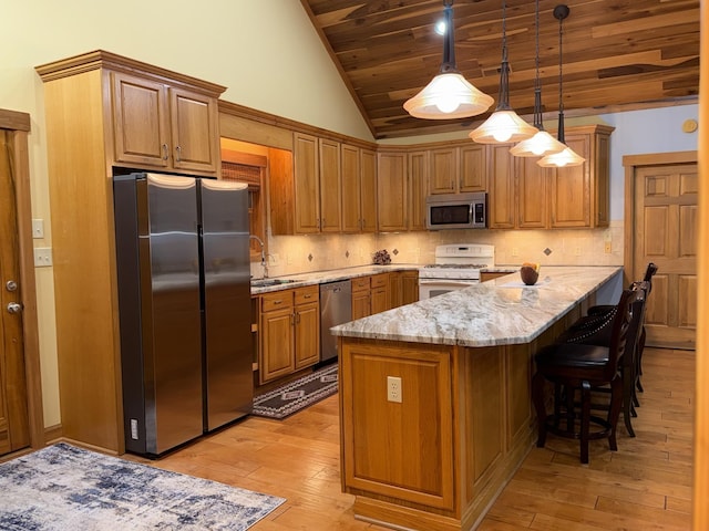 61 Brim Ln, Hilham, TN 38568 - kitchen with light wood-style flooring, light stone countertops, lofted ceiling, wood ceiling, and appliances with stainless steel finishes