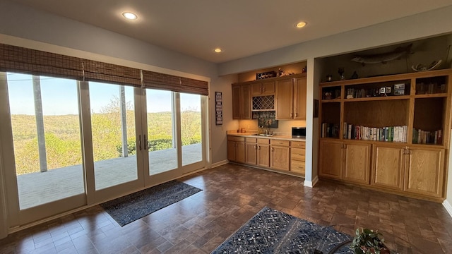 61 Brim Ln, Hilham, TN 38568 - doorway to outside with a sink, baseboards, recessed lighting, and stone finish floor