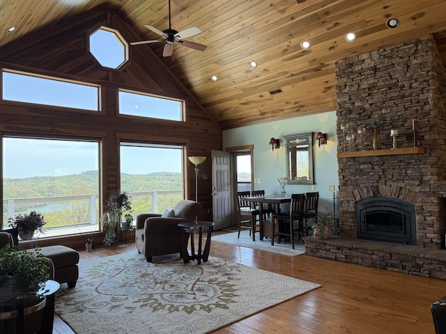 61 Brim Ln, Hilham, TN 38568 - living room with a stone fireplace, ceiling fan, hardwood / wood-style flooring, recessed lighting, and high vaulted ceiling