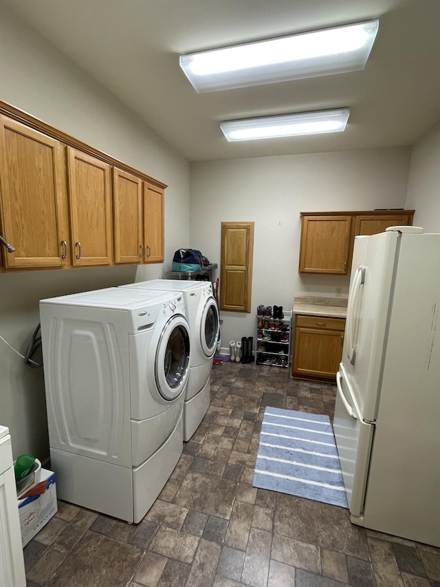 61 Brim Ln, Hilham, TN 38568 - laundry room featuring cabinet space, stone finish floor, and washer and dryer