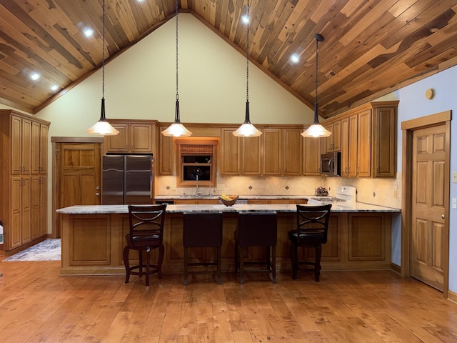 61 Brim Ln, Hilham, TN 38568 - kitchen with light wood-style flooring, appliances with stainless steel finishes, and high vaulted ceiling