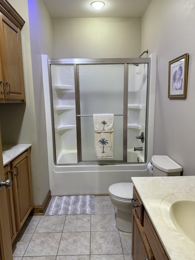 61 Brim Ln, Hilham, TN 38568 - full bathroom featuring toilet, tile patterned floors, vanity, and combined bath / shower with glass door