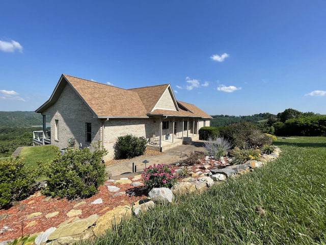 61 Brim Ln, Hilham, TN 38568 - view of front of house featuring brick siding and a shingled roof