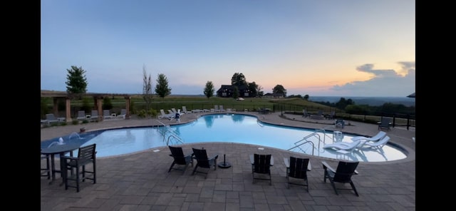 61 Brim Ln, Hilham, TN 38568 - pool at dusk with fence, a community pool, and a patio
