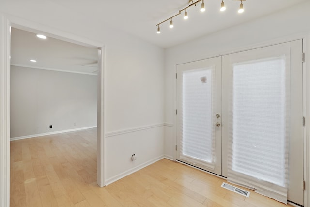 foyer with light hardwood / wood-style flooring