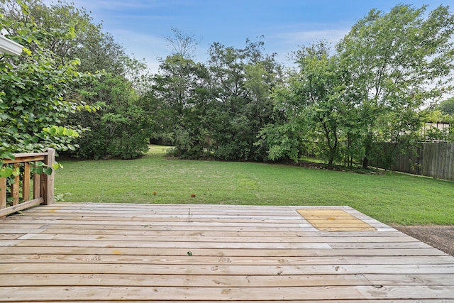 wooden deck with a yard