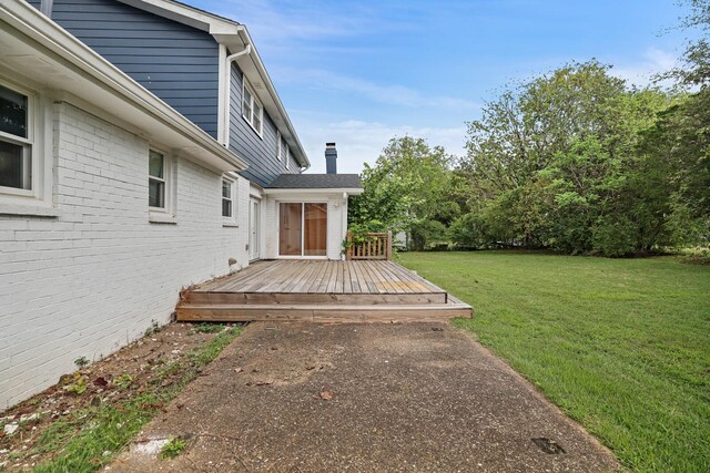 view of yard featuring a wooden deck