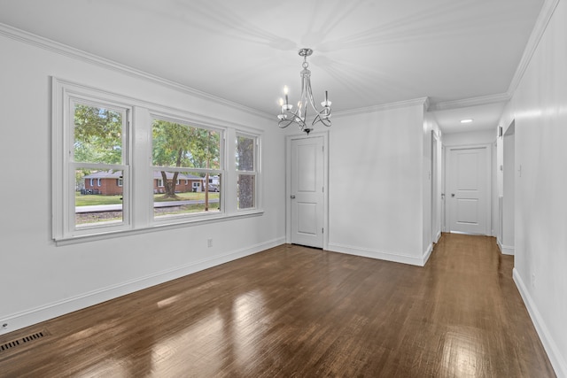 unfurnished dining area featuring crown molding, dark wood-type flooring, and a chandelier