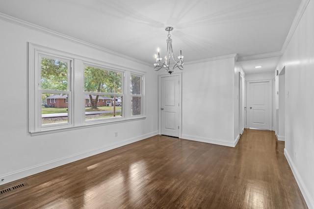 unfurnished dining area with baseboards, visible vents, dark wood finished floors, and crown molding