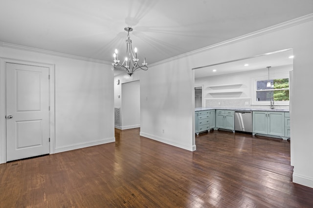 unfurnished dining area featuring crown molding, dark hardwood / wood-style floors, a chandelier, and sink