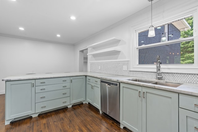 kitchen with sink, dishwasher, light stone counters, decorative light fixtures, and kitchen peninsula