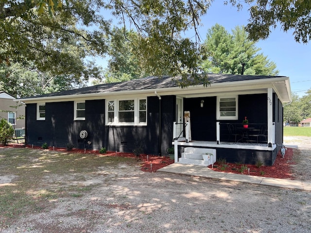 view of front of house featuring covered porch and crawl space