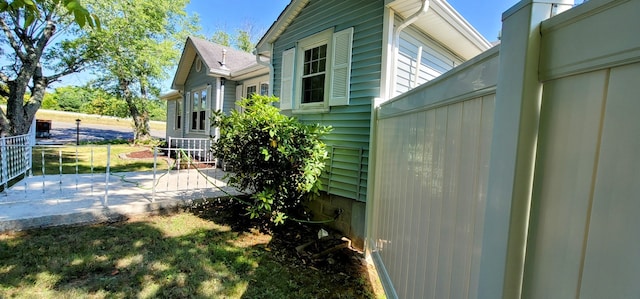 view of property exterior with a patio