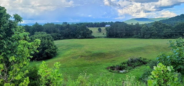 view of mountain feature with a rural view