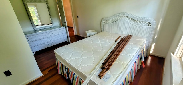 bedroom featuring dark wood-type flooring